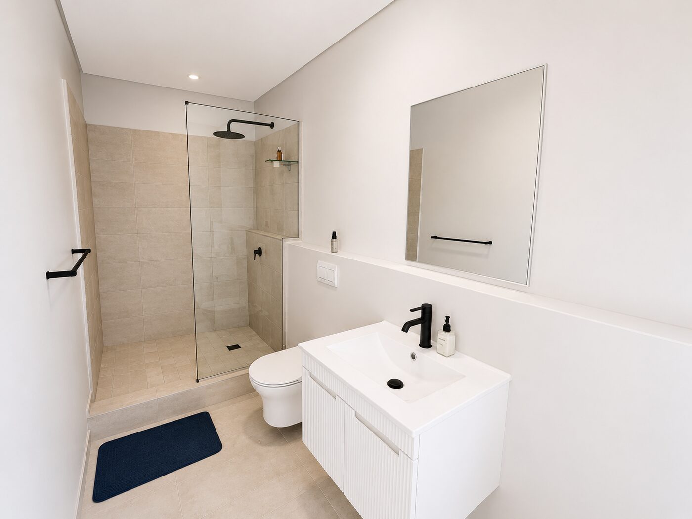 Modern private bathroom at The Village Stay with walk-in shower